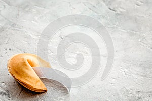 Prediction in fortune cookie on stone background fmockup