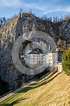 Predjama Castle Slovenia on a bright sunny day (Portrait Orientation