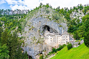 Predjama castle, Slovenia. Scenic view of Predjama castle near Postojna cave mouth. Anciend architecture builded in the rock. Old