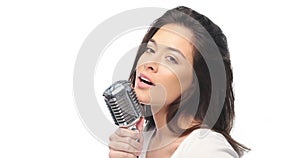 Preety woman singing into a microphone