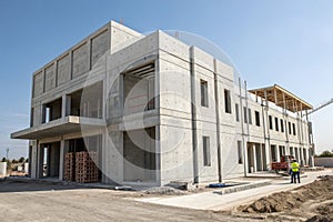 Prefab concrete building structure assembly in progress