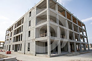 Prefab concrete building structure assembly in progress