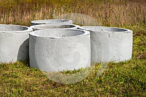 Prefabricated concrete sewer situated on a green meadow