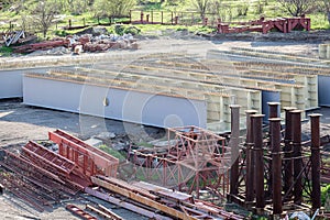 prefabricated parts of the bridge. steel welded beams and supports for bridge construction