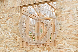 Prefabricated wooden house construction site, wood beam joists and wood chip boards