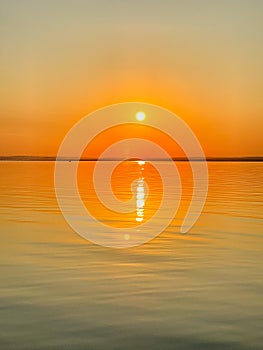 Prefect sunset reflection on a lake. Photo taken from a boat