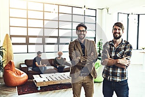 We prefer succeeding together. two designers standing in a modern office.