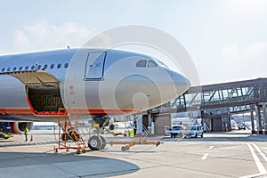 Preflight service, aircraft maintenance, baggage is loading into the luggage compartment of the aircraft at the airport