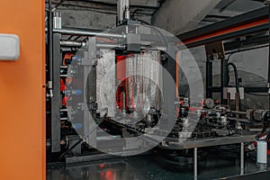 The preform shape of PET bottle in the blowing mold machine. The operation of PET bottle processing by blowing process