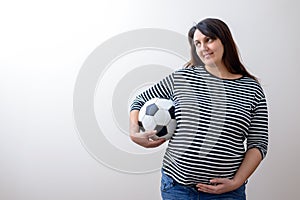 Pregant woman with soccer ball