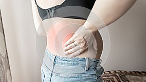 Pregnancy back pain. Beautiful pregnant woman suffer from back pain, backache. Ache spine therapy, healthcare concept.