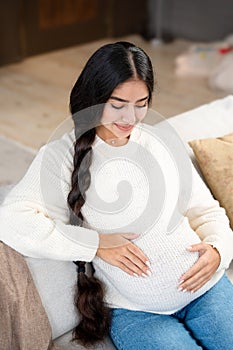 Pregnancy with beautiful pregnant woman hugging her belly photo