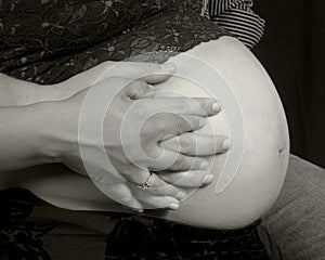 Pregnancy belly with hands