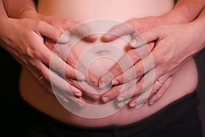 Pregnancy belly with hands