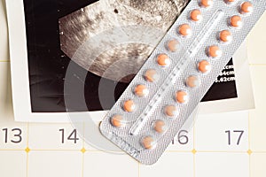 Pregnancy birth control pills with ultrasound scan of baby uterus, contraception health and medicine