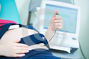 Pregnancy care. cardiotocography fetal heartbeat examination