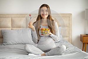 Pregnancy Diet. Beautiful Young Pregnant Woman Holding Bowl With Fresh Vegetable Salad