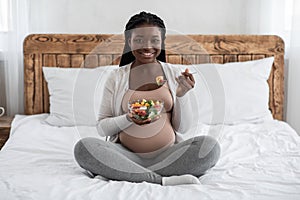 Pregnancy Diet And Nutrition. Pregnant African American Woman Eating Fresh Vegetable Salad