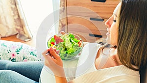 Pregnancy eating healthy salad. Happy pregnant woman eating nutrition food. People lifestyle food concept.