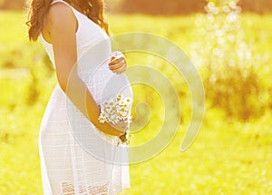 Pregnancy lovely woman with flowers
