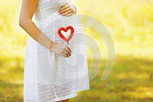 Pregnancy, maternity and new family concept - pregnant woman