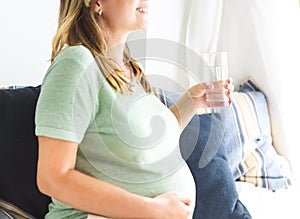 Pregnancy, motherhood- close up of happy pregnant woman