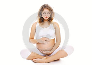 Pregnancy, motherhood, fitness and yoga concept - happy pregnant