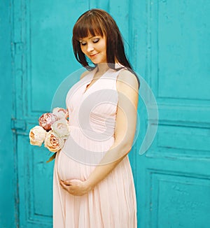 Pregnancy, motherhood and happy future mother concept - woman