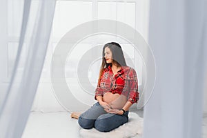 pregnancy, motherhood, people and expectation concept - close up of happy pregnant woman