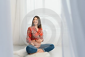 pregnancy, motherhood, people and expectation concept - close up of happy pregnant woman