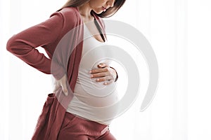 Pregnancy Pain. Cropped Shot Of Young Pregnant Lady Feeling Unwell At Home