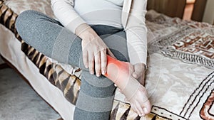 Pregnancy pain leg woman. Pregnant girl have leg disease, ankle pain doing health massage exercise. Foot swelling during