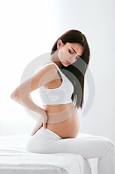 Pregnancy Pain. Pregnant Woman Feeling Back Pain