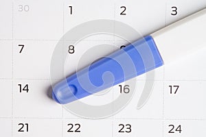 Pregnancy test for birth control on calendar, contraception health and medicine