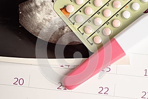 Pregnancy test and birth control pills with ultrasound scan of baby uterus, contraception health and medicine