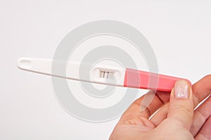 Pregnancy test positive with two lines on the white