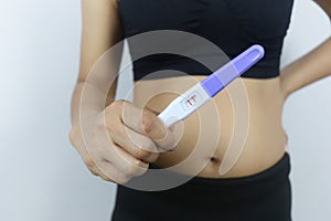 Pregnancy test tool in woman`s hand