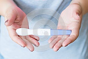 Pregnancy test woman hand result conceiving child photo