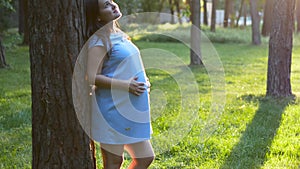 Pregnant 9 month woman dreaming close up