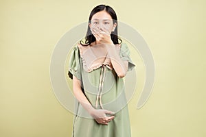 Pregnant asian woman is feeling nauseous