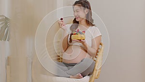 Pregnant asian woman holding fresh berry fruit Blueberries strawberries and eating for high vitamin C.Pregnancy Berry Fruits with