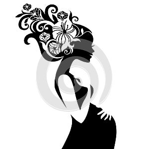 Pregnant beautiful woman silhouette with floral hair