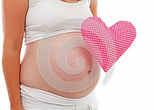 Pregnant belly with checkered heart