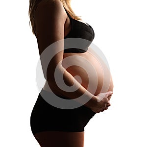 Pregnant belly isolated against white background