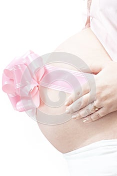 Pregnant belly with pink bow