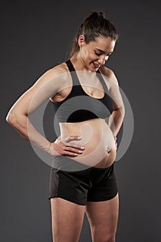 Pregnant bodybuilder lady working out