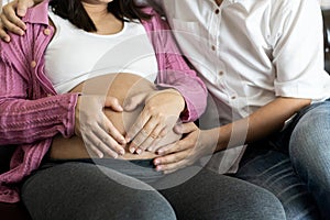 Pregnant couple feels love and relax at home