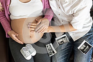 Pregnant couple feels love and relax at home