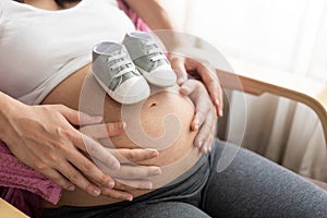 Pregnant couple feels love and relax at home