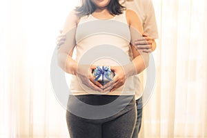 Pregnant couple feels love and relax at home